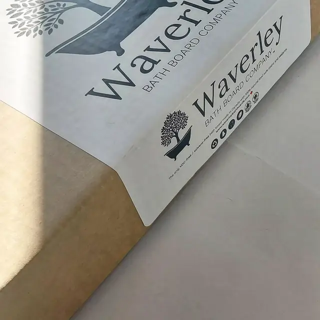 A Waverley Bath Board Company label on kraft packaging, showing the tree-and-tub mark.